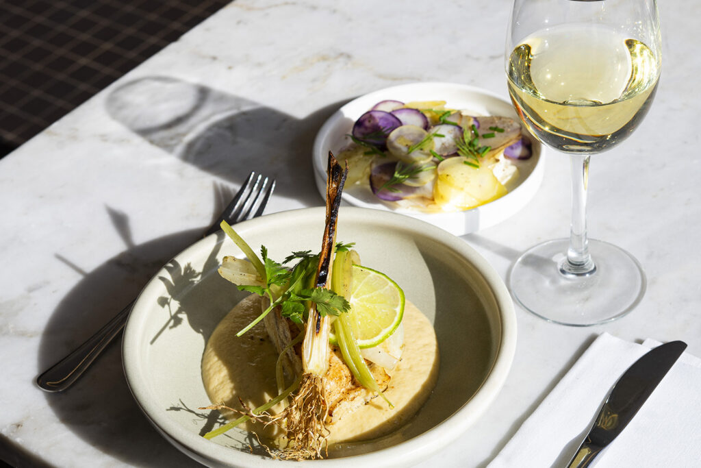 Witlof special autumn dish side view white wine and side vegetables