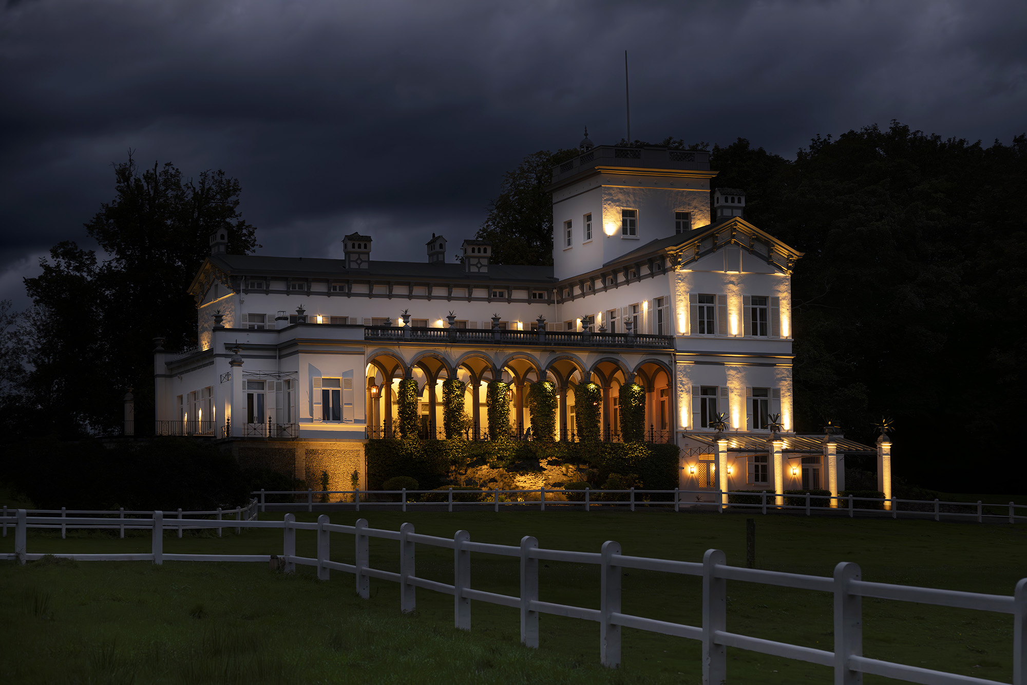 Chateau Drogenbos Contact Evening view elegant exterior lightsjpg